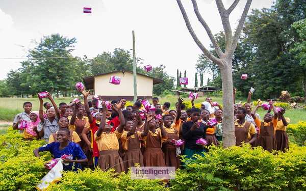 Sharing pads to girls at Obom Kojoman Basic School